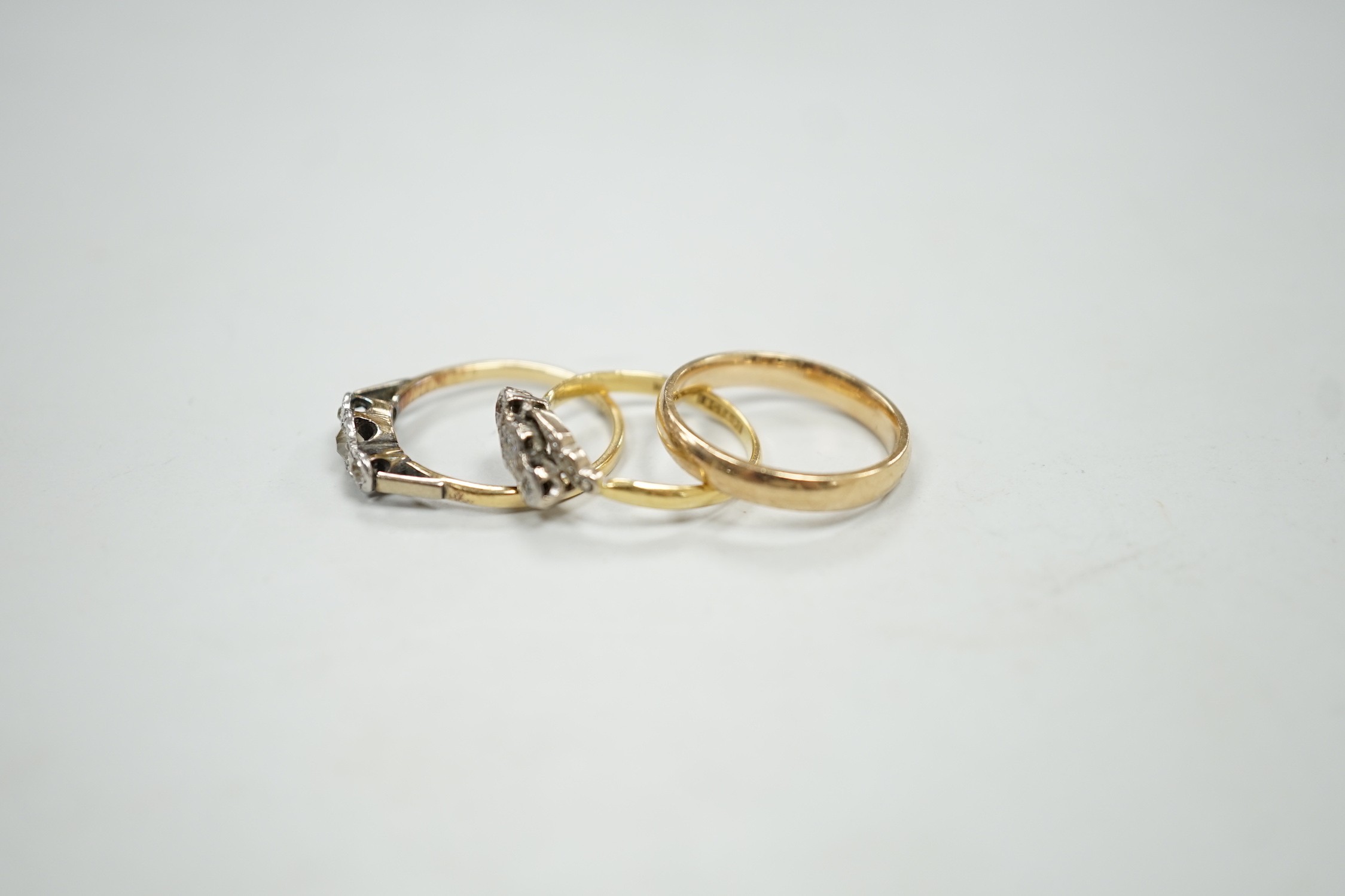 A 9ct gold wedding band, size O/P, 3 grams and two 1940's 18ct and illusion set diamond chip rings, gross 4.4 grams.